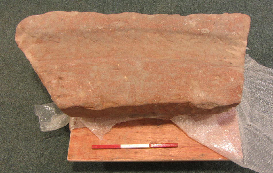 A carved gutter stone from the reserve collection, accession CDBM 020