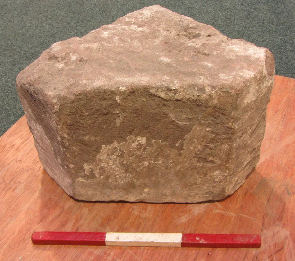 Triangular piece of structural stone, date unknown, accession CDBM 052